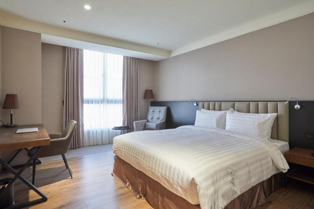 Postel nebo postele na pokoji v ubytování Lai Hotel