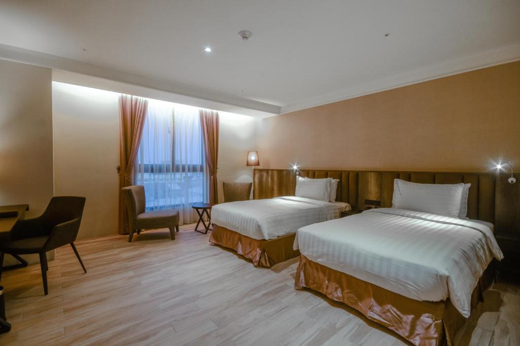 Postel nebo postele na pokoji v ubytování Lai Hotel
