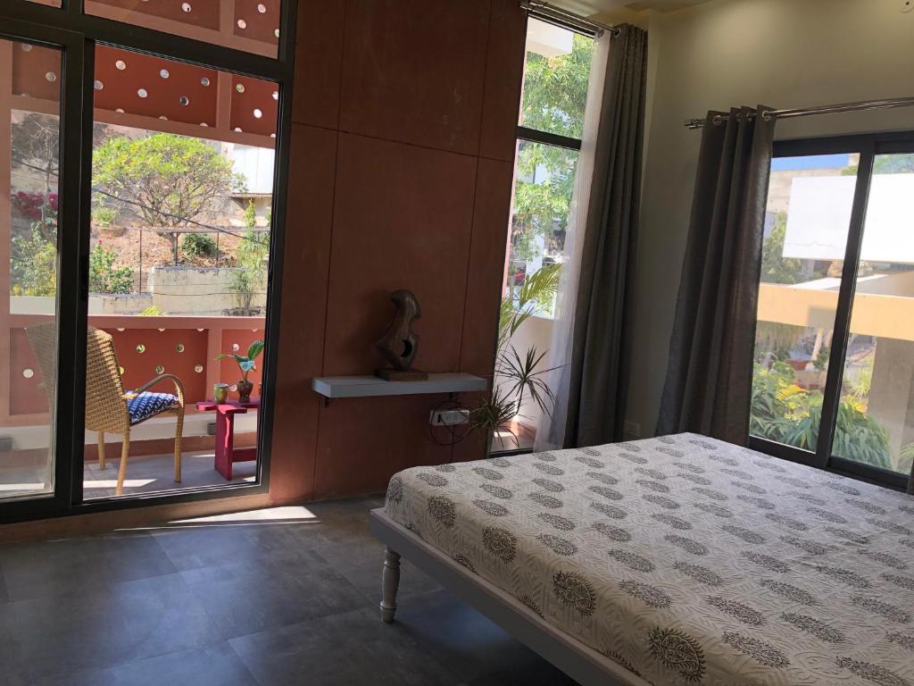 Krevet ili kreveti u jedinici u okviru objekta Kalpana Yoga Homestay
