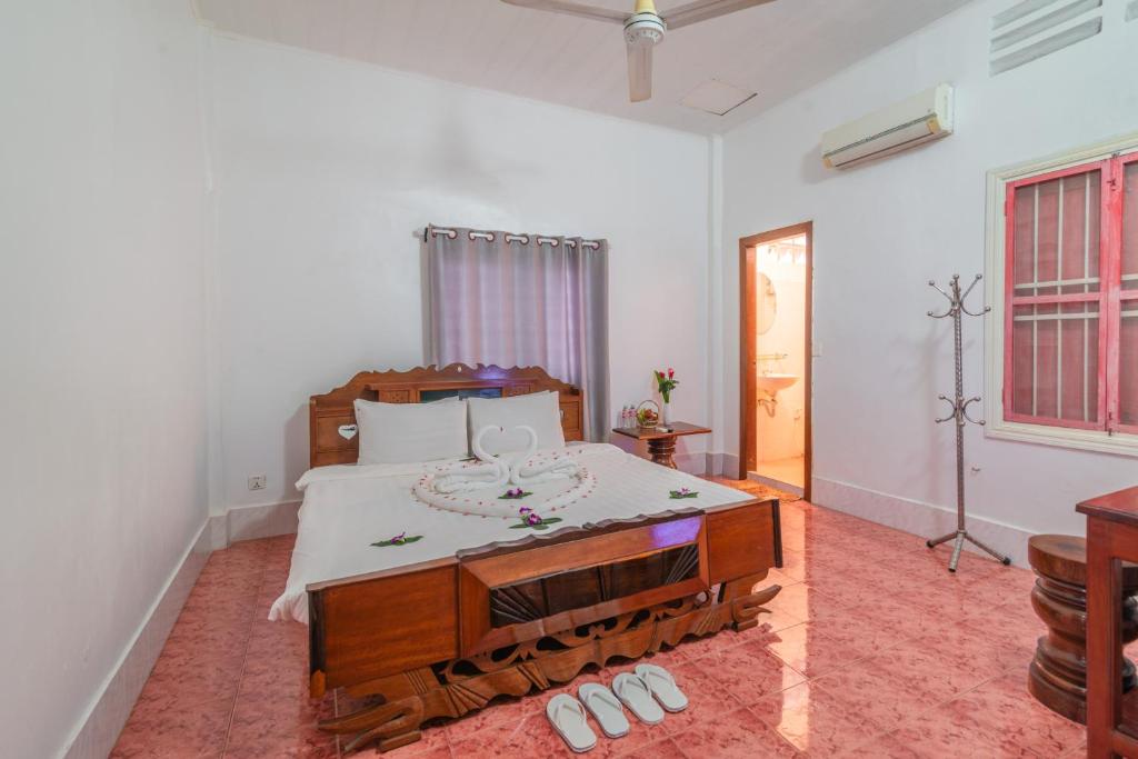 Postel nebo postele na pokoji v ubytování Five Rose Siem Reap Hostel