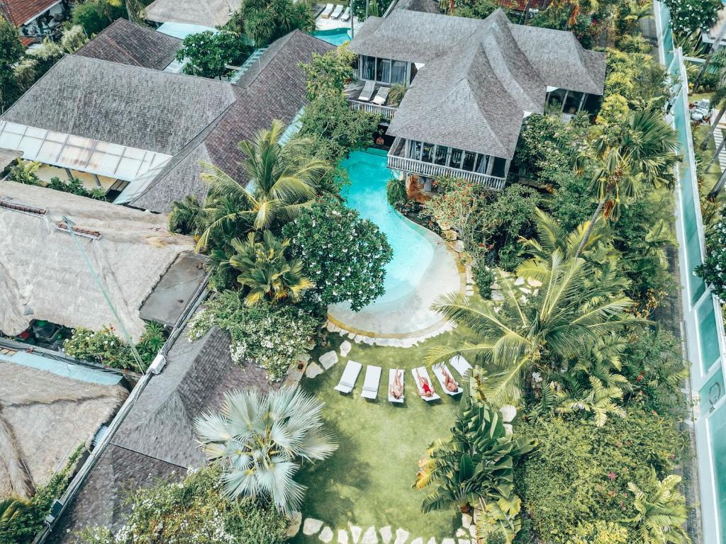 an aerial view of a house with a swimming pool at Phinisi Villas - Seminyak Beach in Seminyak
