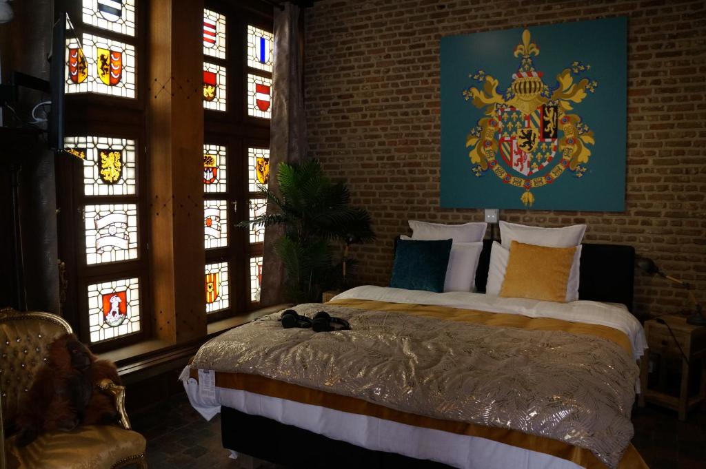 Postel nebo postele na pokoji v ubytování Charming Suites Jan Zonder Vrees