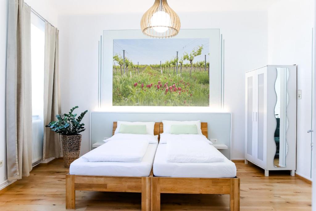 
Ein Bett oder Betten in einem Zimmer der Unterkunft Vino Verde
