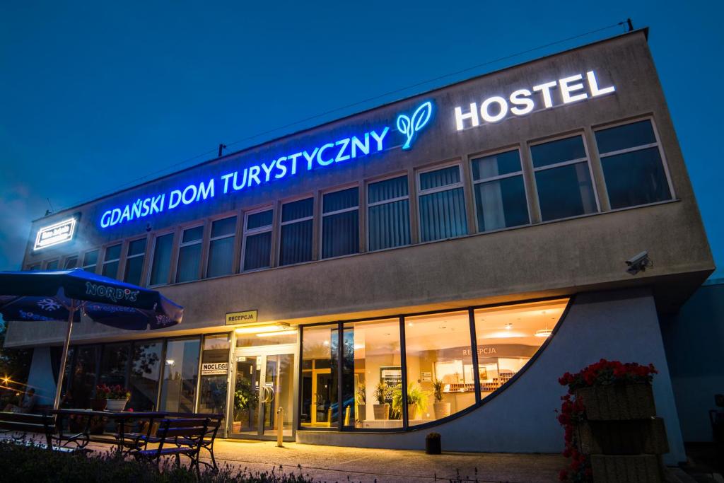 a hospital building with a sign that readscussion dawn tumney hospital at Gdański Dom Turystyczny Hostel in Gdańsk