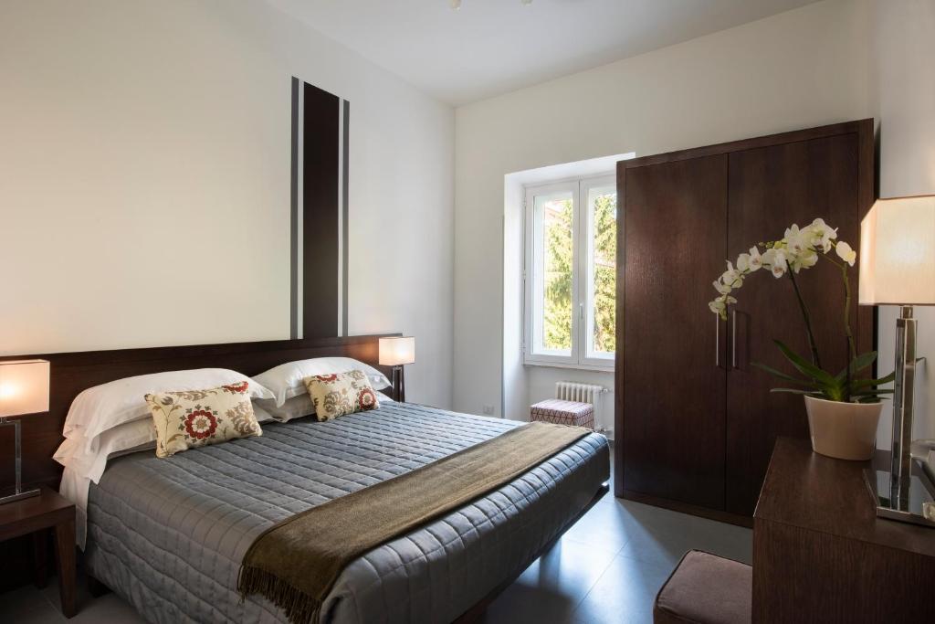 Postel nebo postele na pokoji v ubytování Residenza Termini