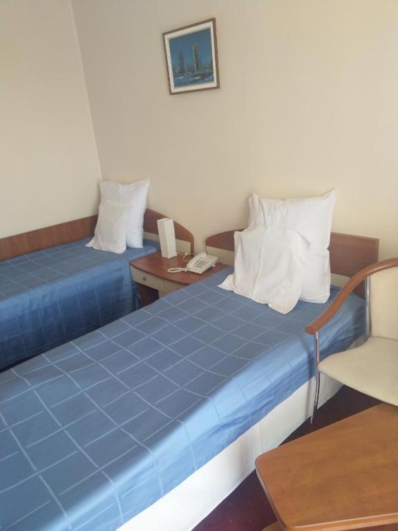Postel nebo postele na pokoji v ubytování Hotel Doina