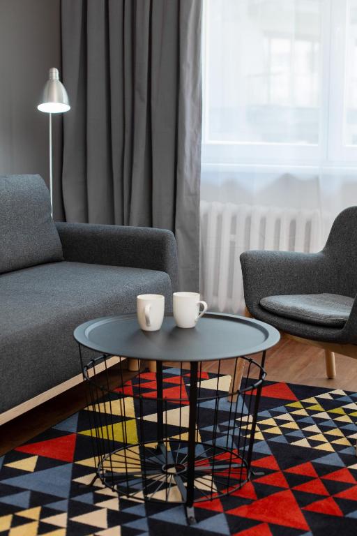 Posedenie v ubytovaní First Central Apartments by Noclegi Renters