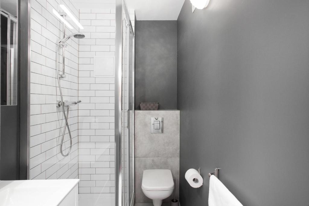 Kúpeľňa v ubytovaní First Central Apartments by Noclegi Renters