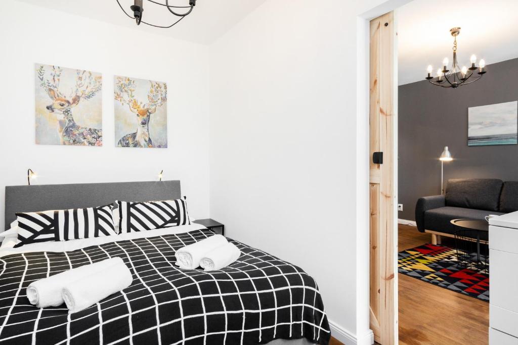 Posteľ alebo postele v izbe v ubytovaní First Central Apartments by Noclegi Renters