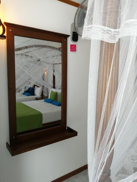 Letto o letti in una camera di Suriya Homestay Mirissa