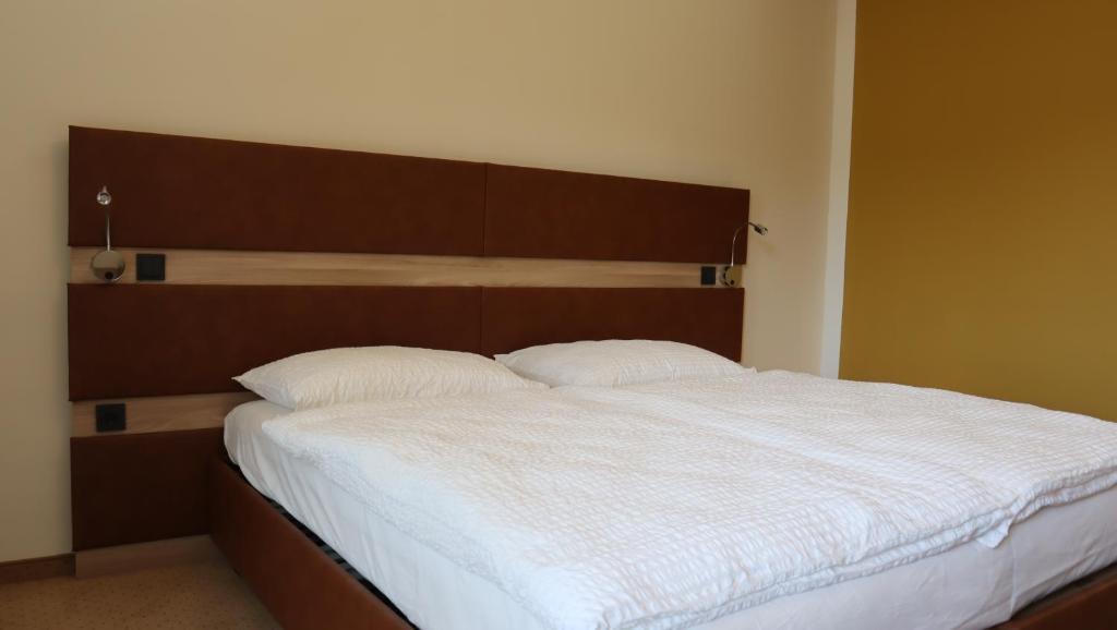 Postel nebo postele na pokoji v ubytování Wartmannstetterhof