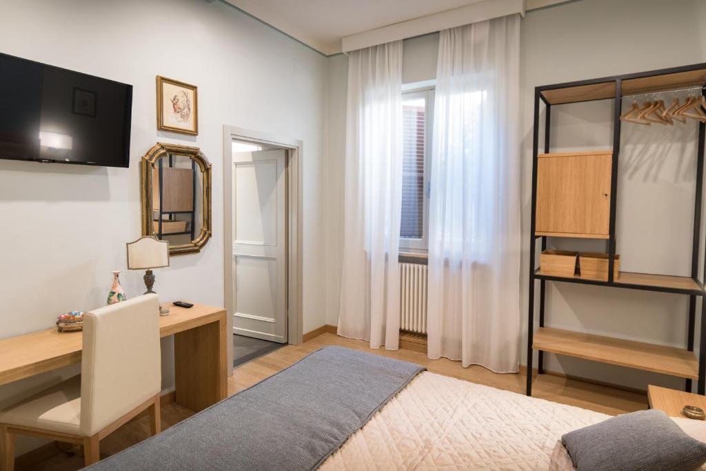 Postel nebo postele na pokoji v ubytování Brunelli B&B