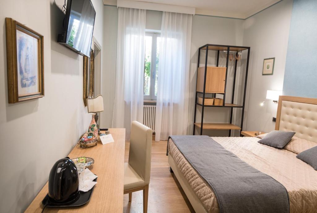 Postel nebo postele na pokoji v ubytování Brunelli B&B