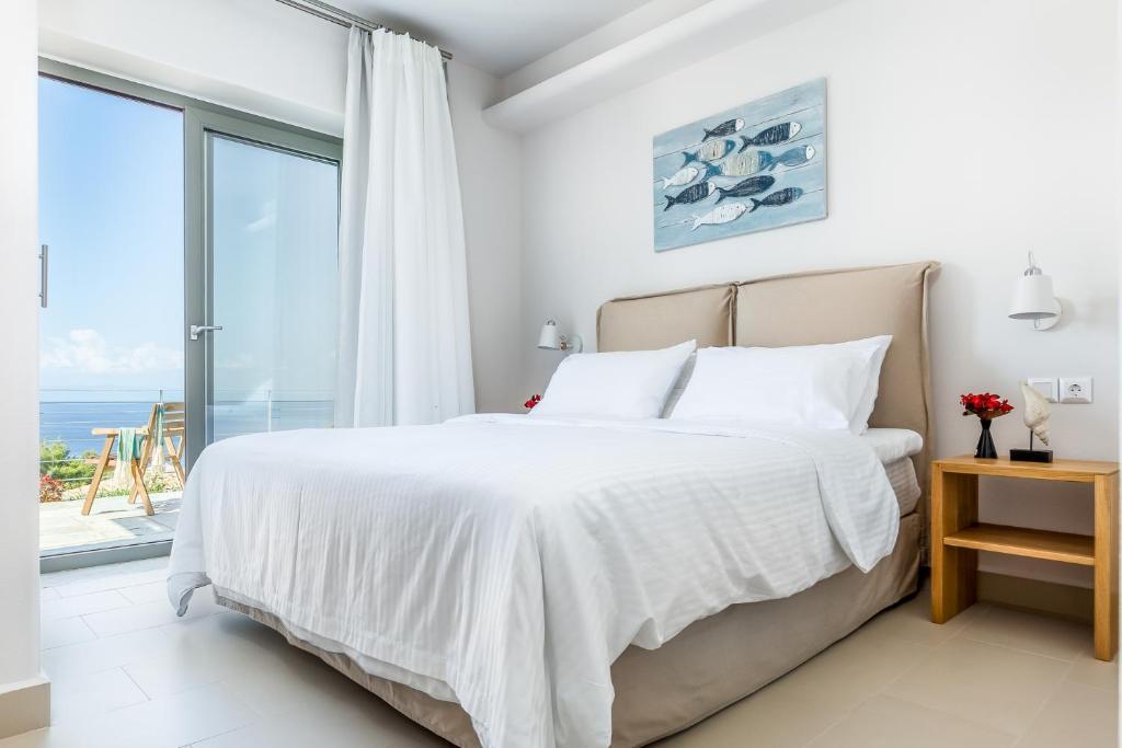 Postel nebo postele na pokoji v ubytování Elios Zen Villas