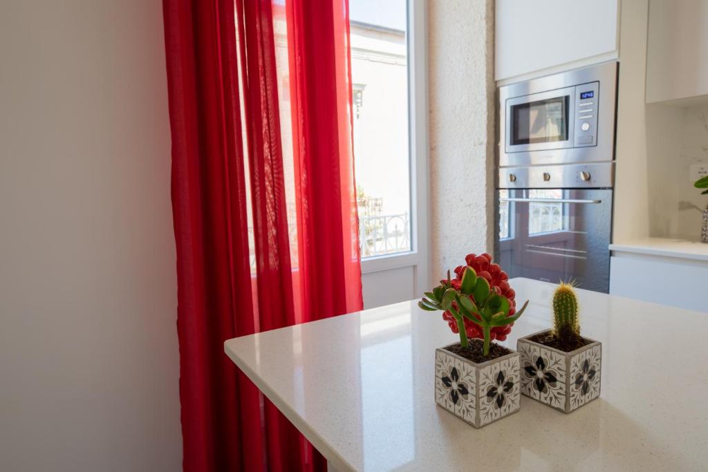 Kuchyňa alebo kuchynka v ubytovaní Ortigia Fab Apartment