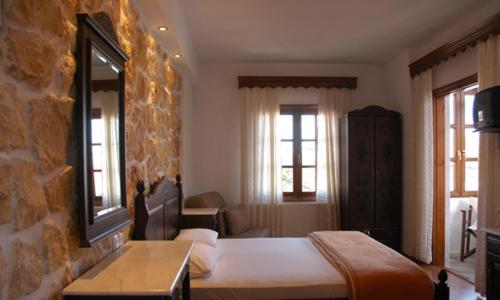 A bed or beds in a room at Guesthouse Papanikolaou