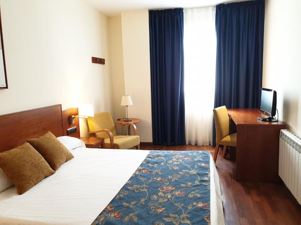 Postel nebo postele na pokoji v ubytování Hotel Suite Camarena