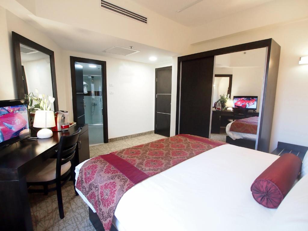Postel nebo postele na pokoji v ubytování New Capitol Hotel - Jerusalem
