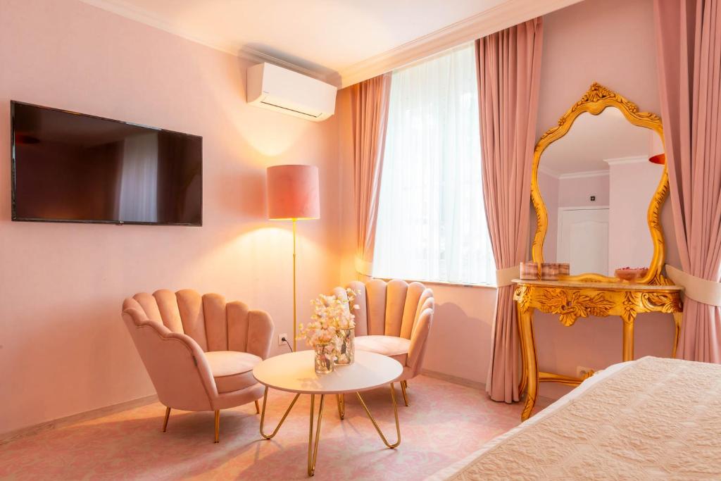 TV a/nebo společenská místnost v ubytování Boutique Hotel Die Swaene