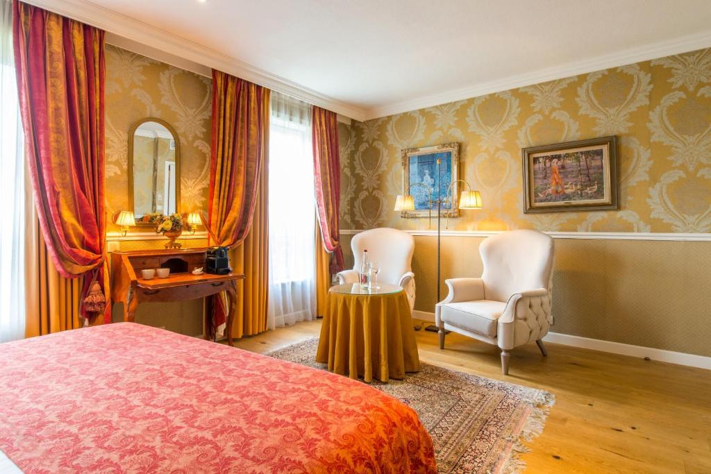 Postel nebo postele na pokoji v ubytování Boutique Hotel Die Swaene