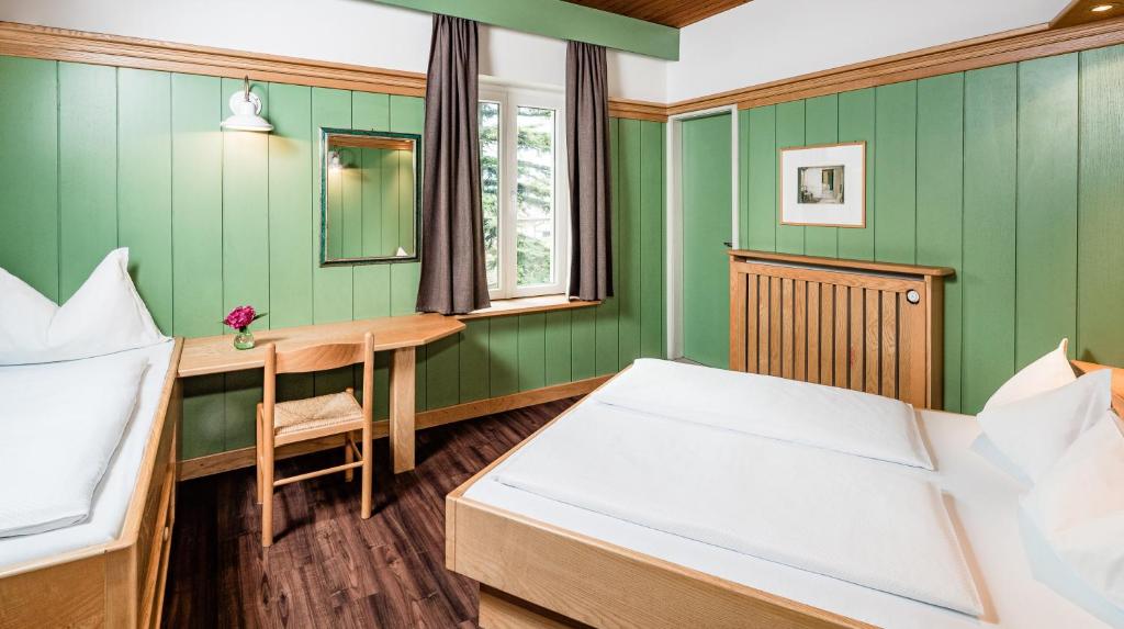 Postel nebo postele na pokoji v ubytování Hotel Heide Park