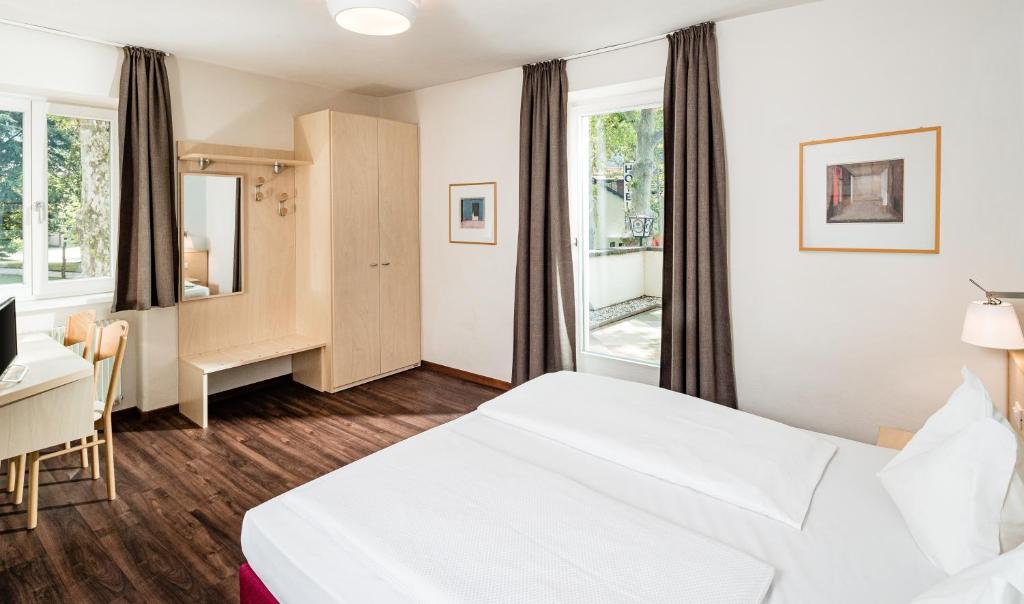 Postel nebo postele na pokoji v ubytování Hotel Heide Park
