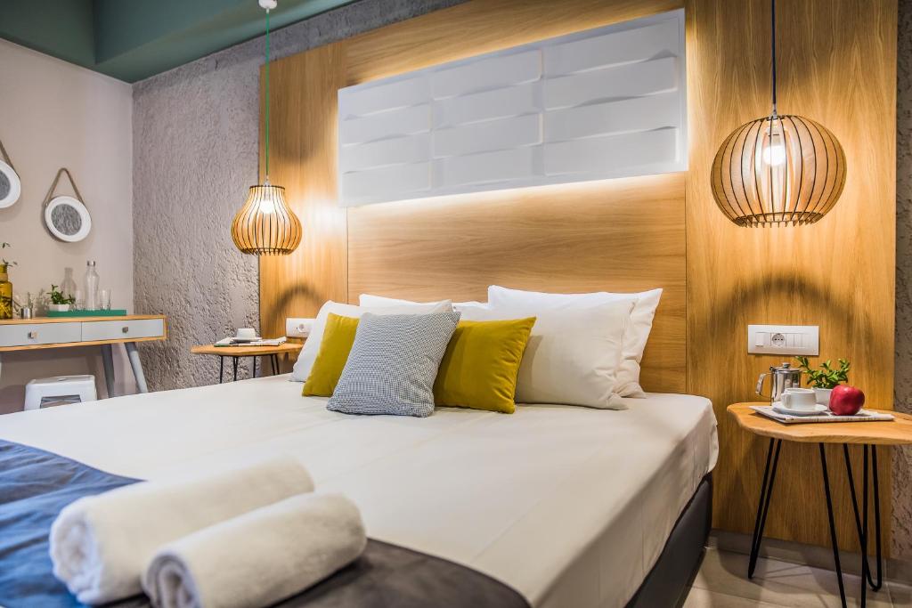 Postel nebo postele na pokoji v ubytování Sunshine Boutique Hotel