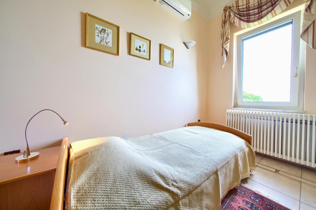 Łóżko lub łóżka w pokoju w obiekcie Villa Baronessa