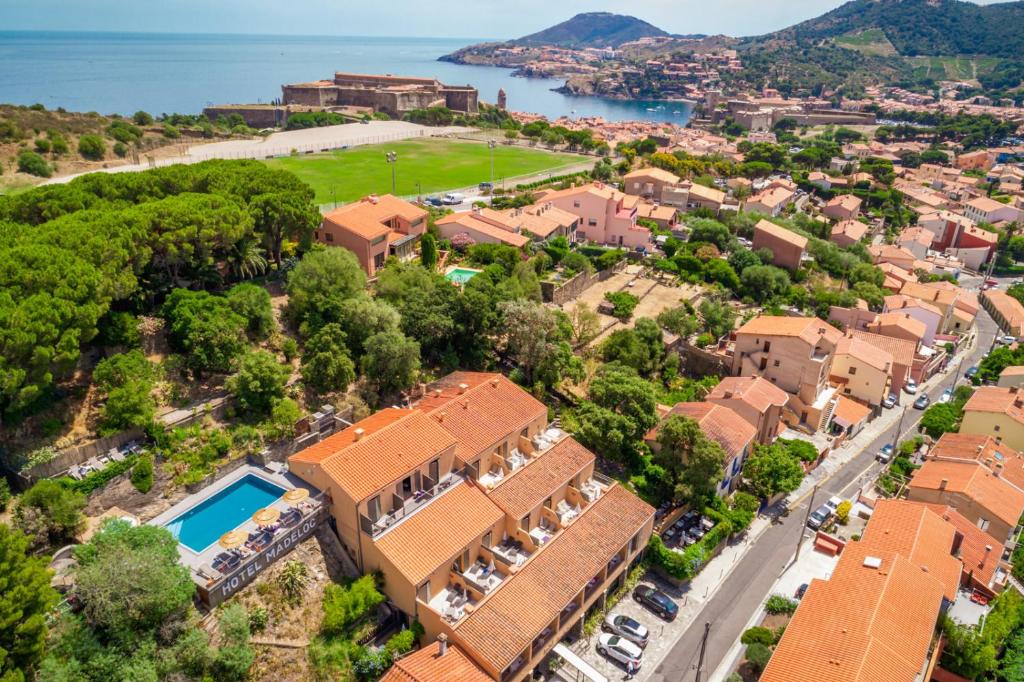 an aerial view of a residential neighbourhood with houses and trees at Le Madeloc Hôtel &amp; Spa in Collioure