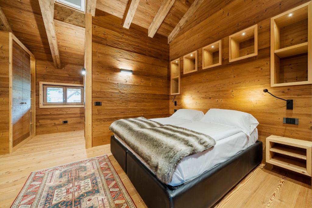 Кровать или кровати в номере Hotel Villa Alpina ***S
