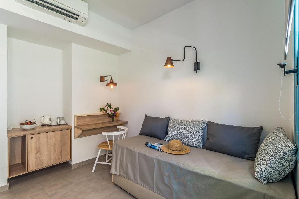 a living room with a couch and a table at Livikon by the Sea in Hora Sfakion