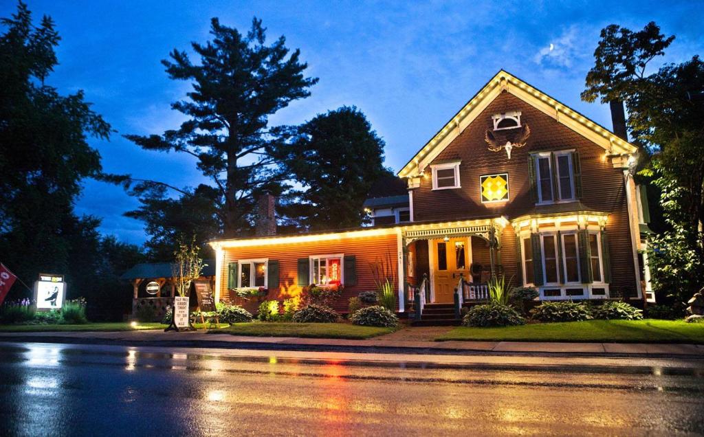 a house with lights on the front of it at The INN in Montgomery