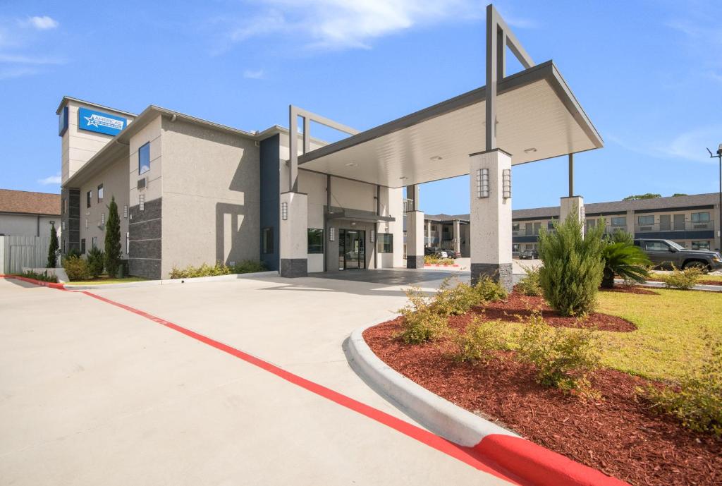 a large building with a cross on the front of it at Americas Best Value Inn & Suites Northeast Houston I-610 in Houston