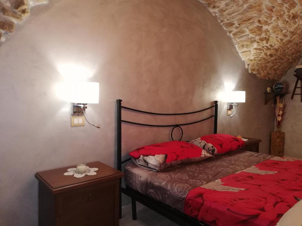 Postel nebo postele na pokoji v ubytování Antica Dimora del Drengot