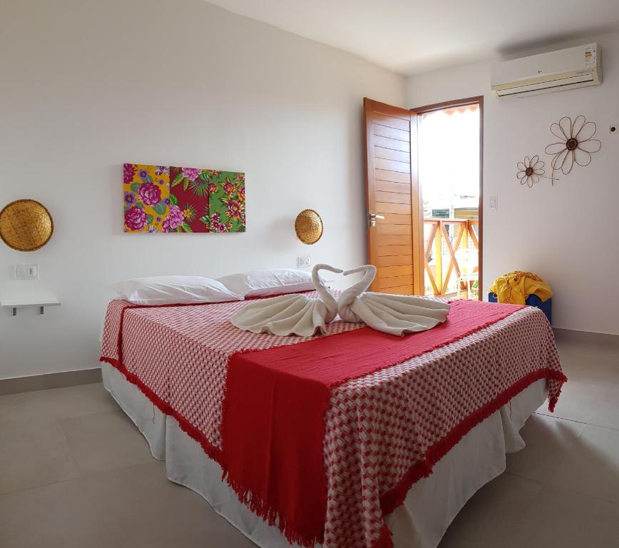 Una cama o camas en una habitación de Paranambuca Pousada