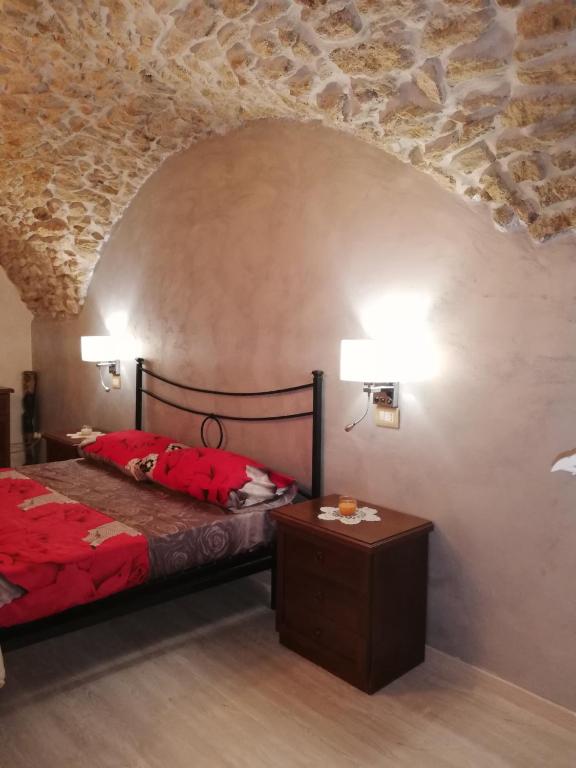 Postel nebo postele na pokoji v ubytování Antica Dimora del Drengot