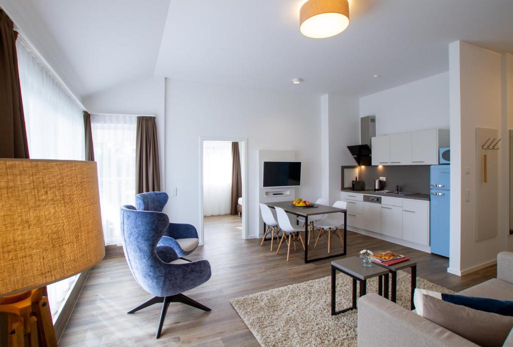 TV a/nebo společenská místnost v ubytování Appartements an der Golfanlage