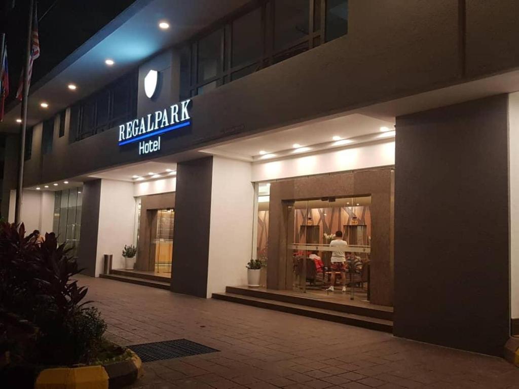 a store front of a building with a sign on it at REGALPARK Hotel Kuala Lumpur in Kuala Lumpur