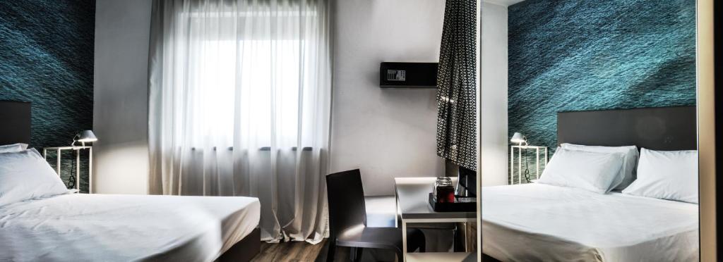 Postel nebo postele na pokoji v ubytování Best Western Hotel Corsi