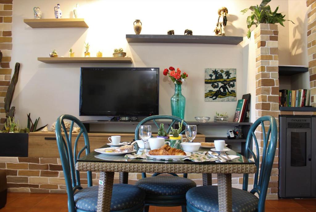TV a/nebo společenská místnost v ubytování B&B Atlante