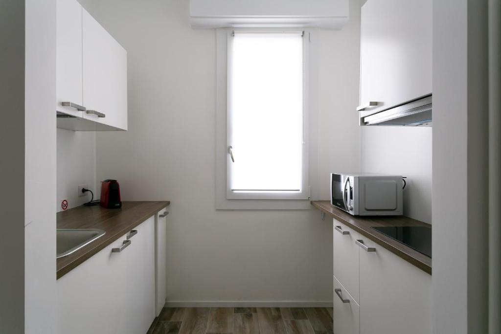 Kuchyňa alebo kuchynka v ubytovaní Milanofierapartments