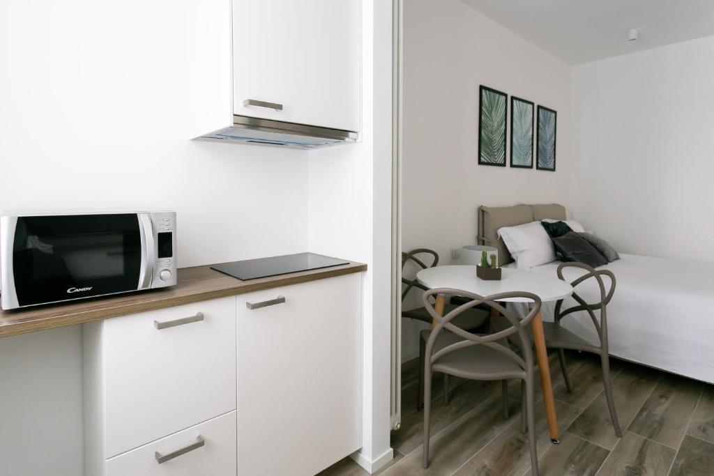 Televízia a/alebo spoločenská miestnosť v ubytovaní Milanofierapartments