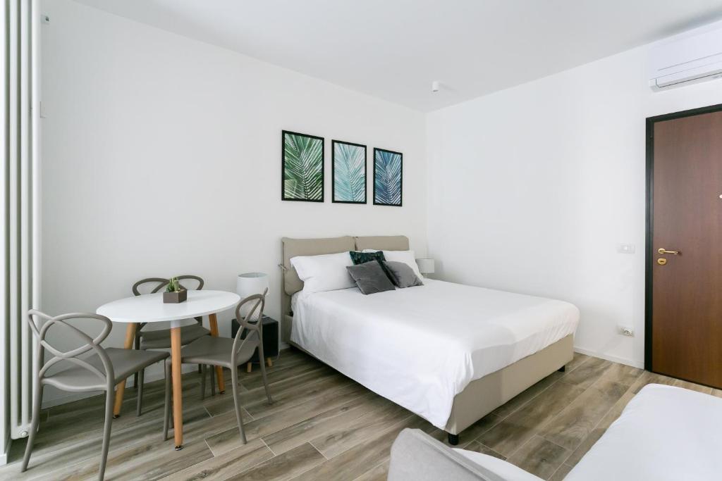 Posteľ alebo postele v izbe v ubytovaní Milanofierapartments
