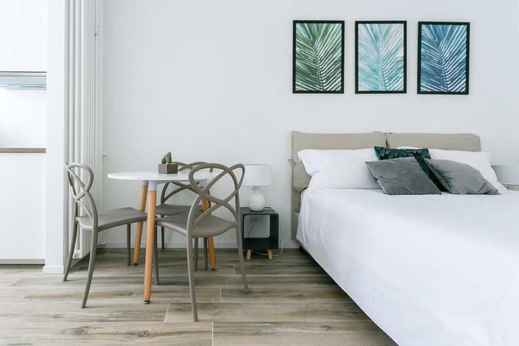 Posteľ alebo postele v izbe v ubytovaní Milanofierapartments