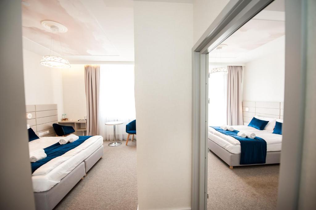 Postel nebo postele na pokoji v ubytování Hotel Gdynia Boutique