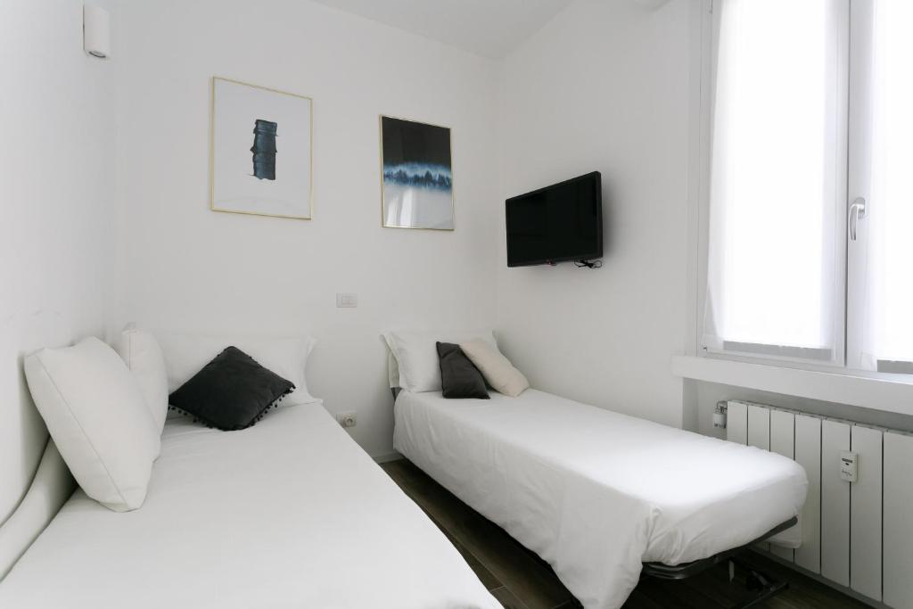 Posteľ alebo postele v izbe v ubytovaní Milanofierapartments