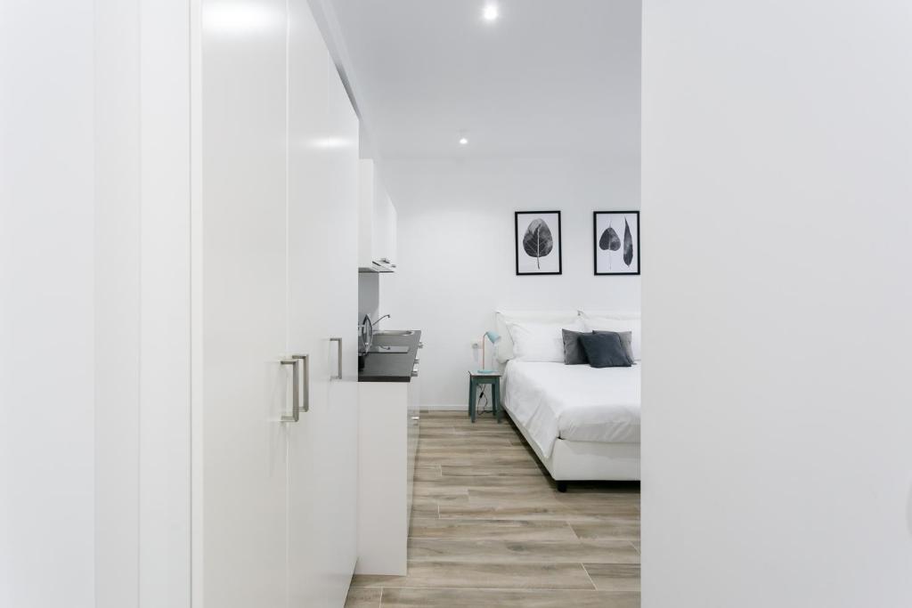 Posteľ alebo postele v izbe v ubytovaní Milanofierapartments