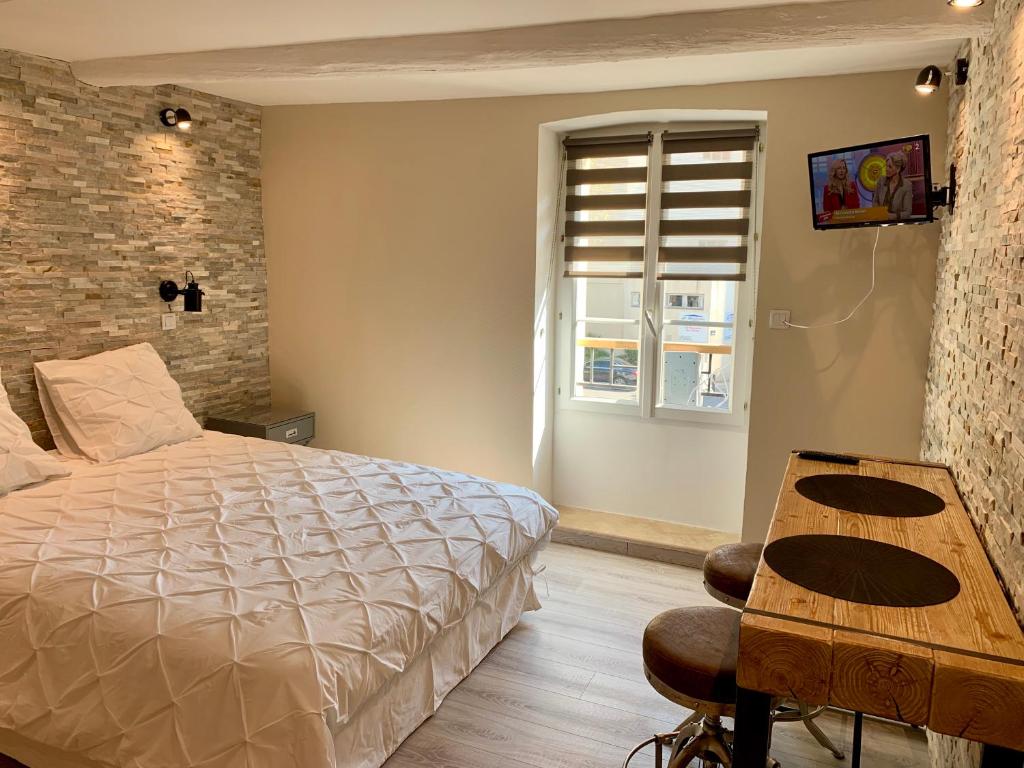 Säng eller sängar i ett rum på Marseille City Chambres&Appartements