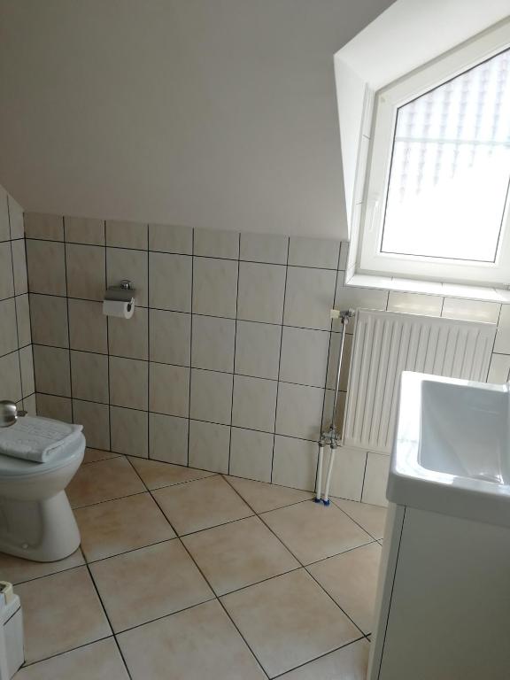 Kúpeľňa v ubytovaní Óvár Apartman