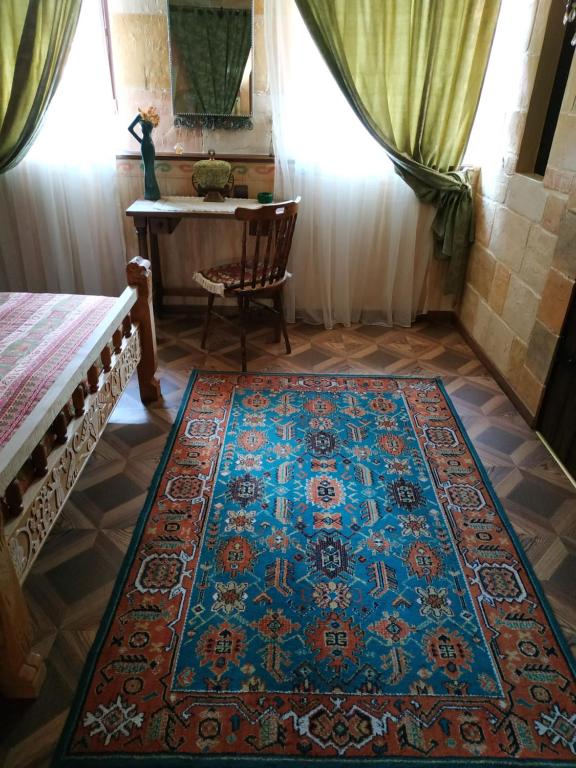 Postel nebo postele na pokoji v ubytování Hye Aspet Հայ Ասպետ